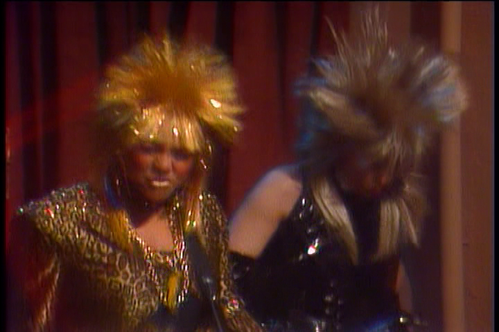 Tootie and Jo, both now with golden spiky hair, jam enthusiastically.